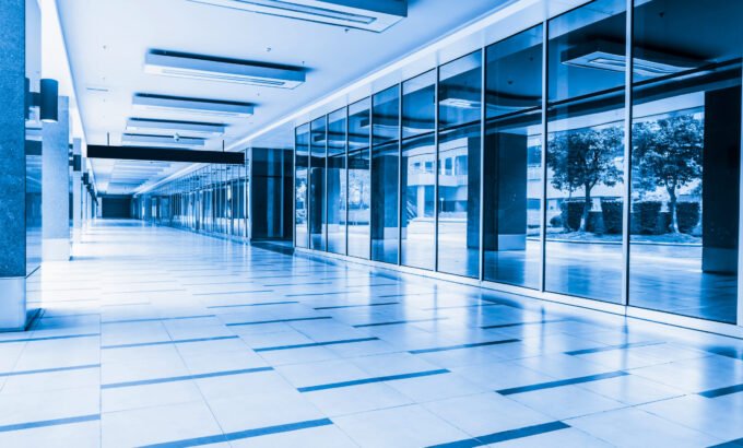 empty long corridor in the modern office building. empty long corridor in the modern office building.