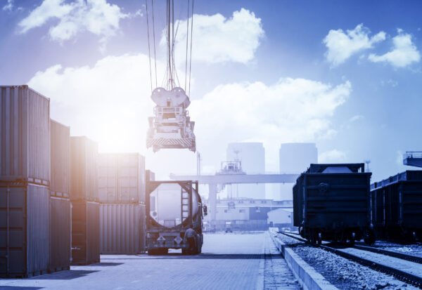 Industrial crane loading Containers in a Cargo freight ship