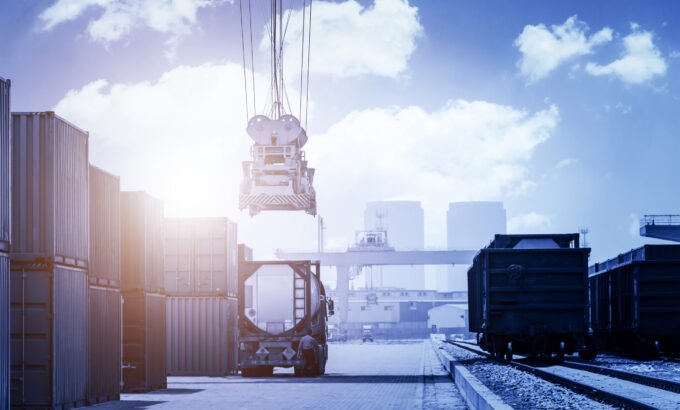 Industrial crane loading Containers in a Cargo freight ship Industrial crane loading Containers in a Cargo freight ship