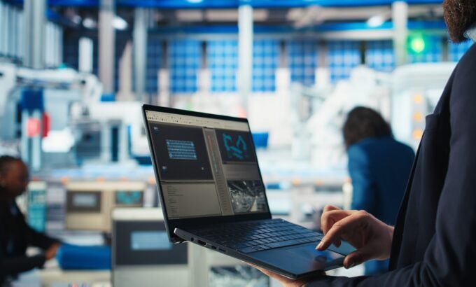 Photovoltaics factory worker analyzing data with laptop Photovoltaics factory worker analyzing data, reviewing system health metrics with laptop. Solar panels manufacturing plant employee troubleshooting technical issues using notebook, camera A close up